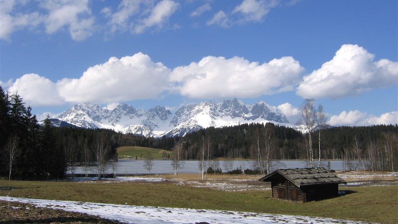 Lake Schwarzsee near Kitzbühel with snow on the distant mountains, photographed in March 2008.