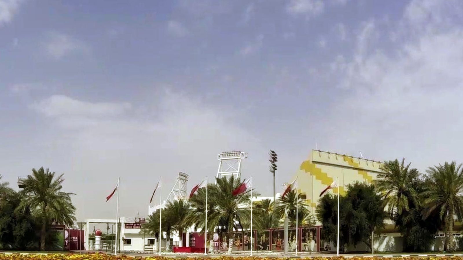 Palm trees and flowers outside the Khalifa Tennis and Squash Complex in Doha